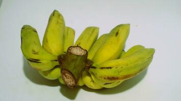 Banana isolated white, a popular fruit that is easy to eat by removing its thick skin, Musa paradisiaca, contains vitamins A, C, and B6 to boost the body immunity. photo