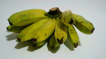 Banana isolated white, a popular fruit that is easy to eat by removing its thick skin, Musa paradisiaca, contains vitamins A, C, and B6 to boost the body immunity. photo