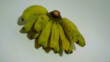 Banana isolated white, a popular fruit that is easy to eat by removing its thick skin, Musa paradisiaca, contains vitamins A, C, and B6 to boost the body immunity. photo