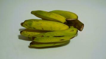 Banana isolated white, a popular fruit that is easy to eat by removing its thick skin, Musa paradisiaca, contains vitamins A, C, and B6 to boost the body immunity. photo