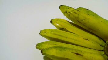 Banana isolated white, a popular fruit that is easy to eat by removing its thick skin, Musa paradisiaca, contains vitamins A, C, and B6 to boost the body immunity. photo