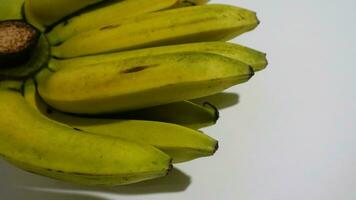 Banana isolated white, a popular fruit that is easy to eat by removing its thick skin, Musa paradisiaca, contains vitamins A, C, and B6 to boost the body immunity. photo
