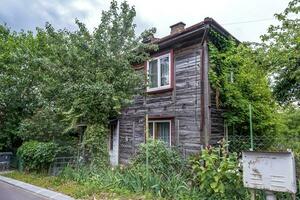 example of hundred-year-old historical building and homestead of private sector in wooden constructivism style photo