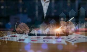 Businessman using the tablet. Data analytics report and key performance indicators on information dashboard for Business strategy, Stock market indicator and financial investment photo