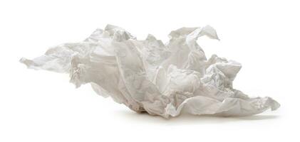 Single screwed or crumpled tissue paper or napkin in strange shape after use in toilet or restroom isolated on white background with clipping path. photo