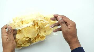 potato chips spilling form a packet on table video