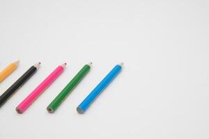 pack of 12  mini colored bunch wood  pencils isolated on a white background with  copy space photo