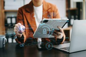 Cyber security and data protection. Business using computer and  tablet protecting business and financial data with virtual from cyber attack, cybersecurity technology in modern office photo