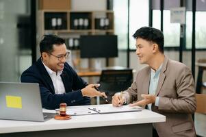 business people and lawyers discussing contract papers sitting at the table. Concepts of law, advice, legal services. photo