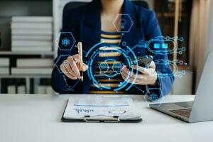 Businessman using chatbot in computer and tablet  smart intelligence Ai.Chat with AI Artificial Intelligence, developed by OpenAI generate. Futuristic technology, robot in online system. photo