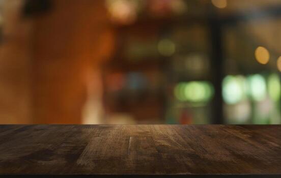 Mock up for space. Empty dark wooden table in front of abstract blurred bokeh background of restaurant . can be used for display or montage your product photo