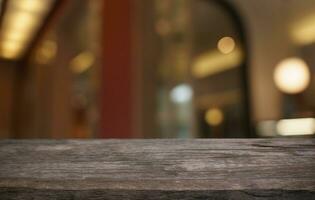 Mock up for space. Empty dark wooden table in front of abstract blurred bokeh background of restaurant . can be used for display or montage your product photo