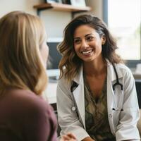 Female doctor consulting with patient in office photo