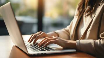 Email marketing. Woman typing on laptop keyboard. photo