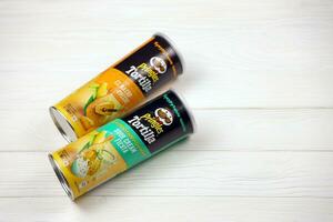 Pringles cylinder tubes with Tortilla el nacho cheese and sour cream fiesta flavour. Pringles is a brand of potato snack chips owned by Kellogg Company photo