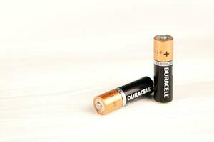 Duracell batteries on white background. Duracell is an American brand of batteries and smart power solutions manufactured by Procter and Gamble photo