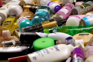 KHARKOV, UKRAINE - JANUARY 2, 2021 Many used bottles and jars for different brandy feminines. Containers for shampoo and lotions, cans for creams and masks photo