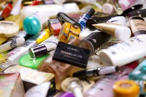 KHARKOV, UKRAINE - JANUARY 2, 2021 Many used bottles and jars for different brandy feminines. Containers for shampoo and lotions, cans for creams and masks photo