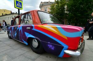 KHARKOV, UKRAINE - MAY 27, 2017 Festival of street art. A car that was painted by masters of street art during the festival. The result of the work of several graffiti artists. Original aerography photo