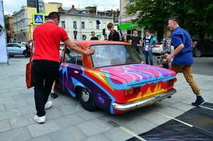 KHARKOV, UKRAINE - MAY 27, 2017 Festival of street art. A car that was painted by masters of street art during the festival. The result of the work of several graffiti artists. Original aerography photo