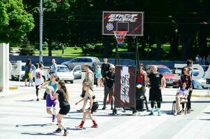 KHARKIV, UKRAINE - 27 MAY, 2018 Women's teams play streetball in the open air during the annual festival of street cultures photo