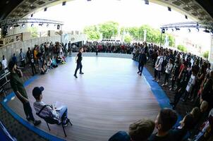 KHARKIV, UKRAINE - 27 MAY, 2018 Dance battle on the festival of street cultures. Break dance and hip-hop children and teenagers photo