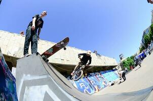 KHARKIV, UKRAINE - 27 MAY, 2018 Skateboarding contest in outdoors skate park during the annual festival of street cultures photo