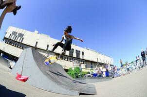 KHARKIV, UKRAINE - 27 MAY, 2018 Skateboarding contest in outdoors skate park during the annual festival of street cultures photo