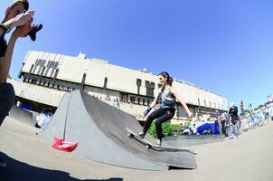 KHARKIV, UKRAINE - 27 MAY, 2018 Skateboarding contest in outdoors skate park during the annual festival of street cultures photo