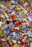 KHARKOV, UKRAINE - AUGUST 10, 2021 Big pile of various wrappings and empty disposable packages and cups from famous branded food production photo