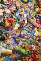 KHARKOV, UKRAINE - AUGUST 10, 2021 Big pile of various wrappings and empty disposable packages and cups from famous branded food production photo