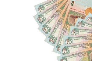 100 Ukrainian hryvnias bills lies isolated on white background with copy space. Rich life conceptual background photo