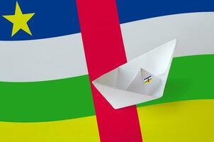 Central African Republic flag depicted on paper origami ship closeup. Handmade arts concept photo