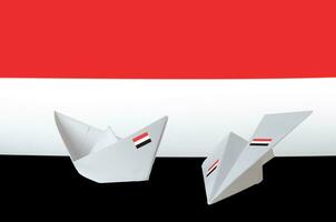 Yemen flag depicted on paper origami airplane and boat. Handmade arts concept photo