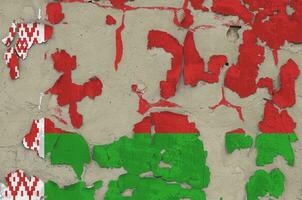 Belarus flag depicted in paint colors on old obsolete messy concrete wall closeup. Textured banner on rough background photo