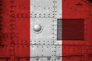 Peru flag depicted on side part of military armored tank closeup. Army forces conceptual background photo