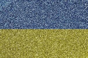 Ukraine flag depicted on many small shiny sequins. Colorful festival background for party photo