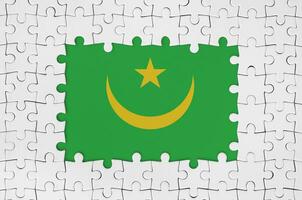 Mauritania flag in frame of white puzzle pieces with missing central part photo