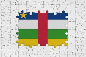 Central African Republic flag in frame of white puzzle pieces with missing central part photo