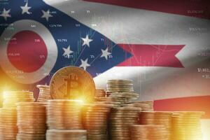 Ohio US state flag and big amount of golden bitcoin coins and trading platform chart. Crypto currency photo