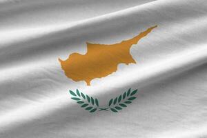 Cyprus flag with big folds waving close up under the studio light indoors. The official symbols and colors in banner photo