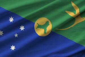 Christmas island flag with big folds waving close up under the studio light indoors. The official symbols and colors in banner photo