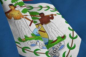 Belize flag with big folds waving close up under the studio light indoors. The official symbols and colors in banner photo