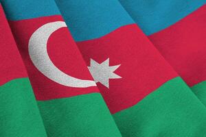 Azerbaijan flag with big folds waving close up under the studio light indoors. The official symbols and colors in banner photo