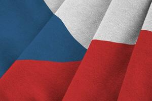 Czech flag with big folds waving close up under the studio light indoors. The official symbols and colors in banner photo