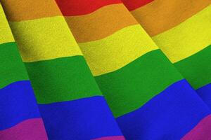 LGBT community flag with big folds waving close up under the studio light indoors. The official symbols and colors in banner photo