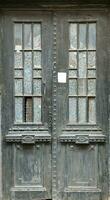 Old ancient wooden door texture in european medieval style photo