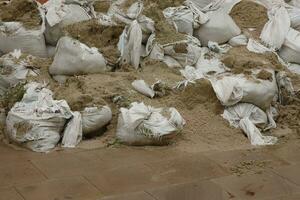 Texture of broken barricade wall of sandbags for war purposes photo