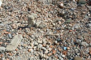 Pile of bricks and fragments of concrete from destroyed building photo