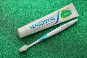 KYIV, UKRAINE - MAY 4, 2022 Sensodyne fluorine or fluor is a daily fluoride toothpaste photo